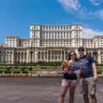 Christy Van Den Heuvel and her husband at Palace of the Parliament Bucharest, Romania