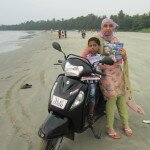 Soudhafaizal and son Mohammed Diyabfaizal on Muzhappilangad beach in Kerala, India
