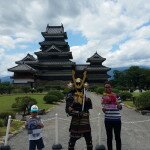 Mohammed and Maitha with a Samurai in front of Matsumoto Castle, Japan
