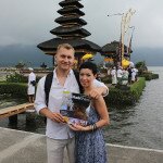 Maryna and Valeriy Nikolaiev at Ulun Danu temple, Bali island, Indonesia