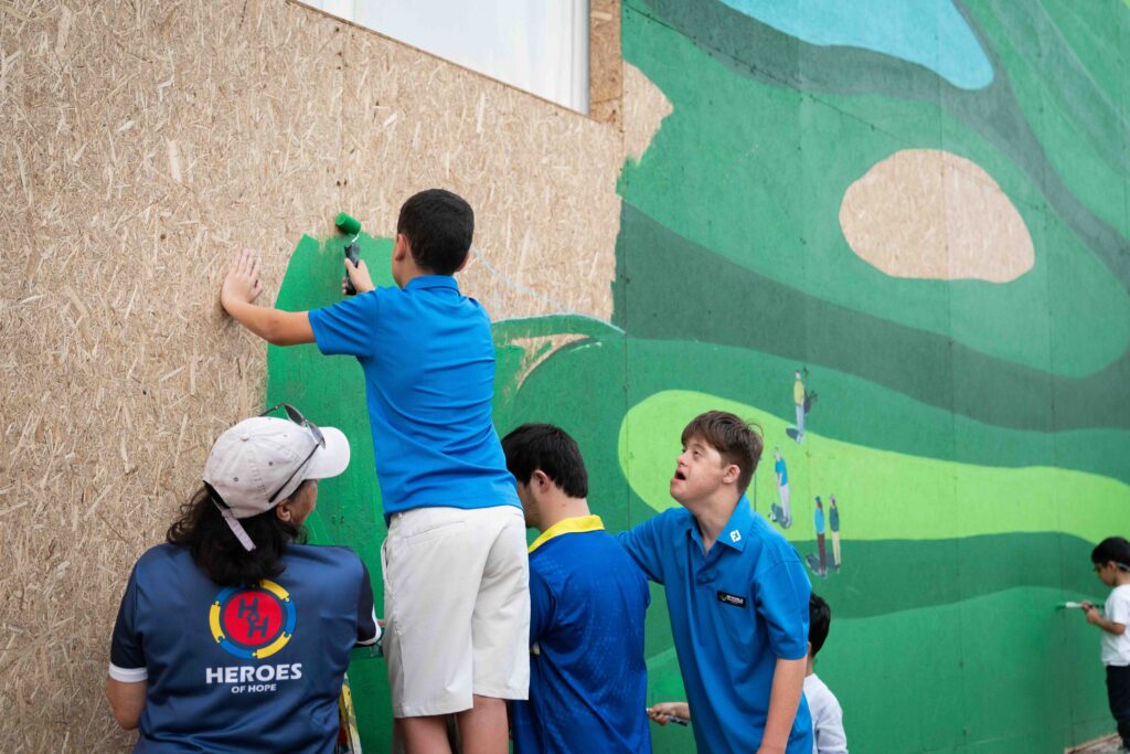 People of Determination Join Artist to Finalise Earth Lounge Mural at DP World Tour Championship